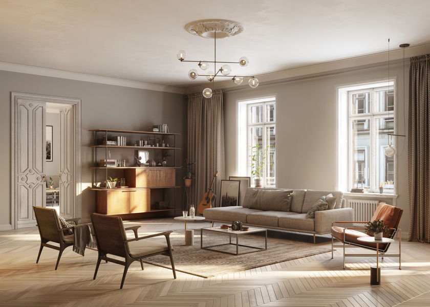 A living room with couch in cream color, a table, a shelf, and windows
