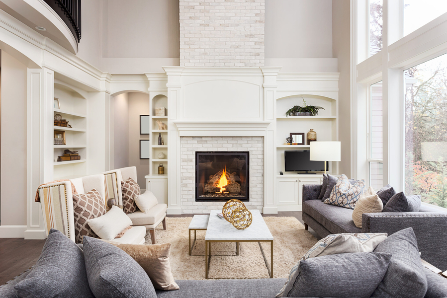 A living room with fireplace and couches